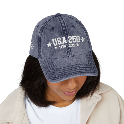 Person wearing a blue denim cap with 'Brooklyn Established New York' text on a white background