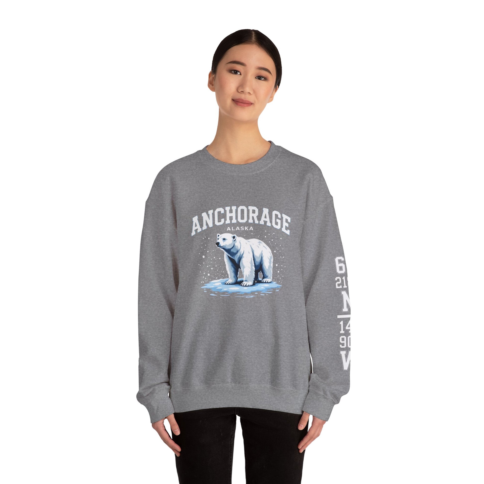 Person wearing a gray sweatshirt with a polar bear graphic and 'Anchorage' text on a white background