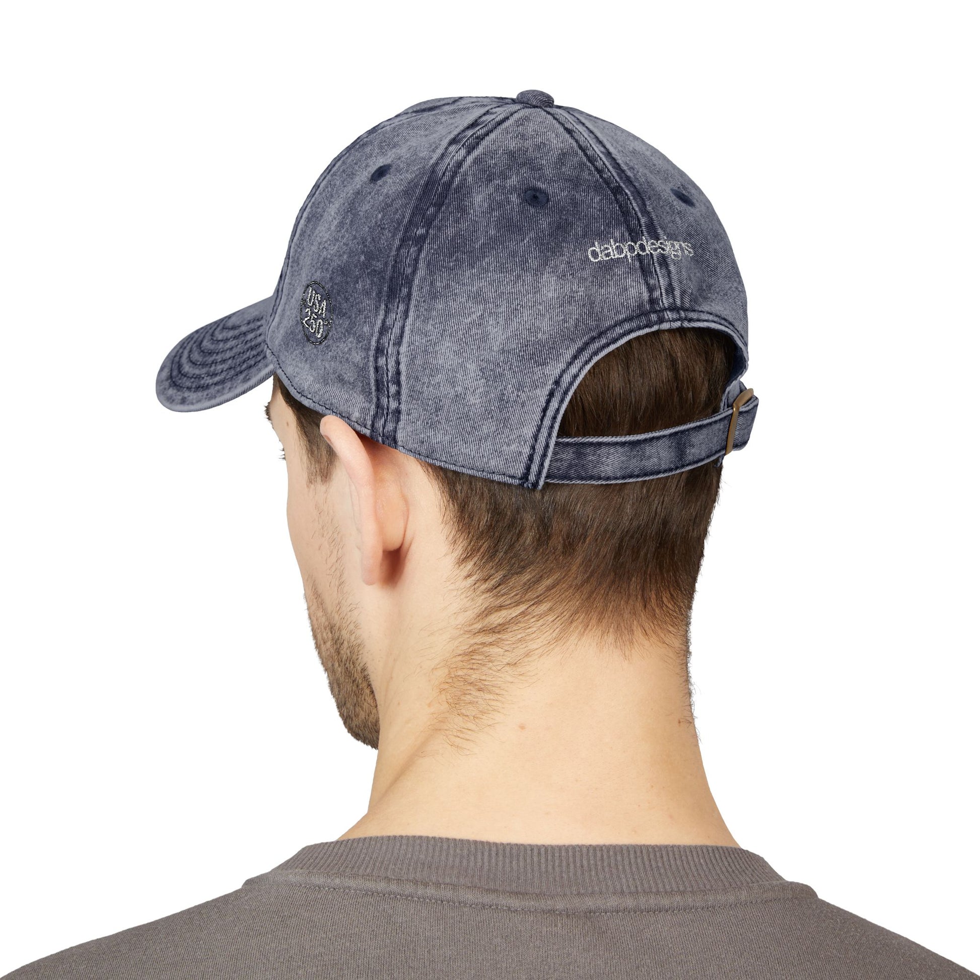 Person wearing a gray denim cap from behind on a white background