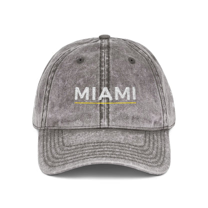 Gray cap with 'abide' embroidered on a white background