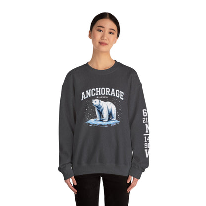 Person wearing a dark gray sweatshirt with a polar bear graphic and 'Anchorage Alaska' text on a white background
