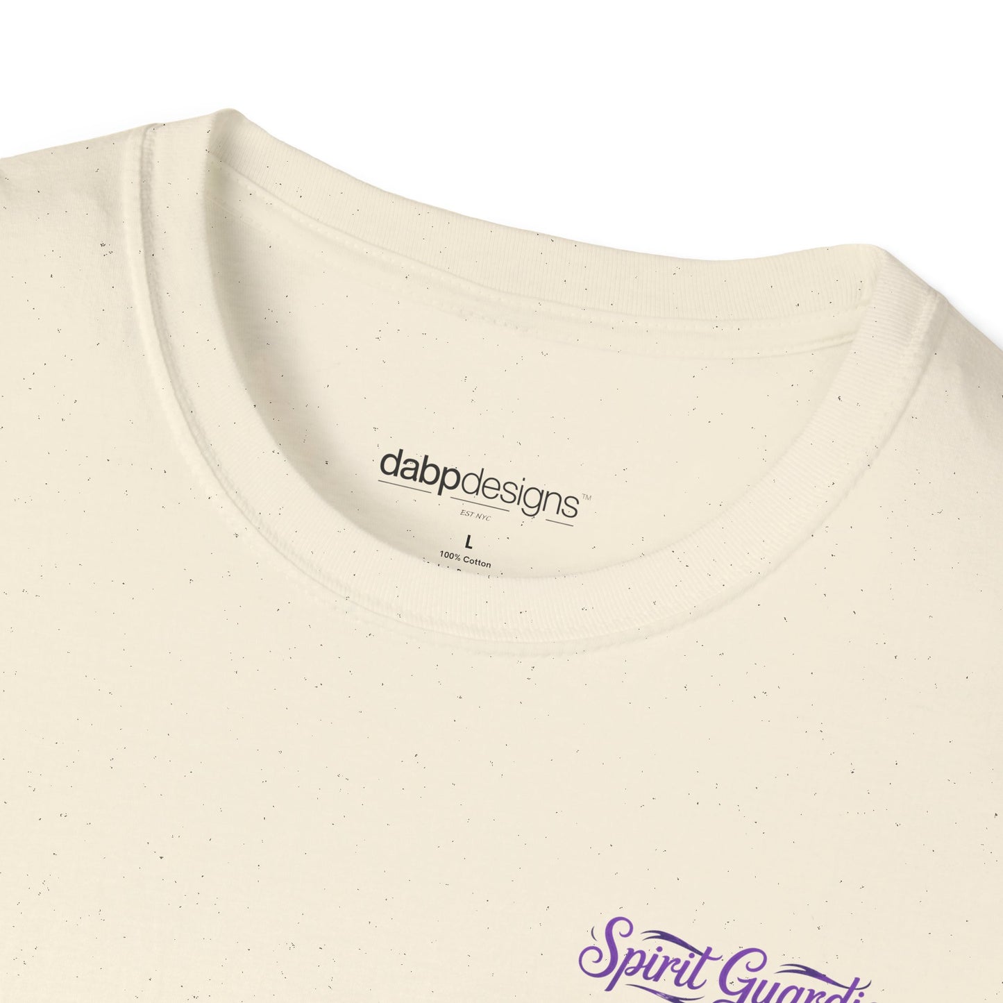 Close-up of a beige t-shirt with 'dabbd designs' logo and 'Spirit Guard' text.