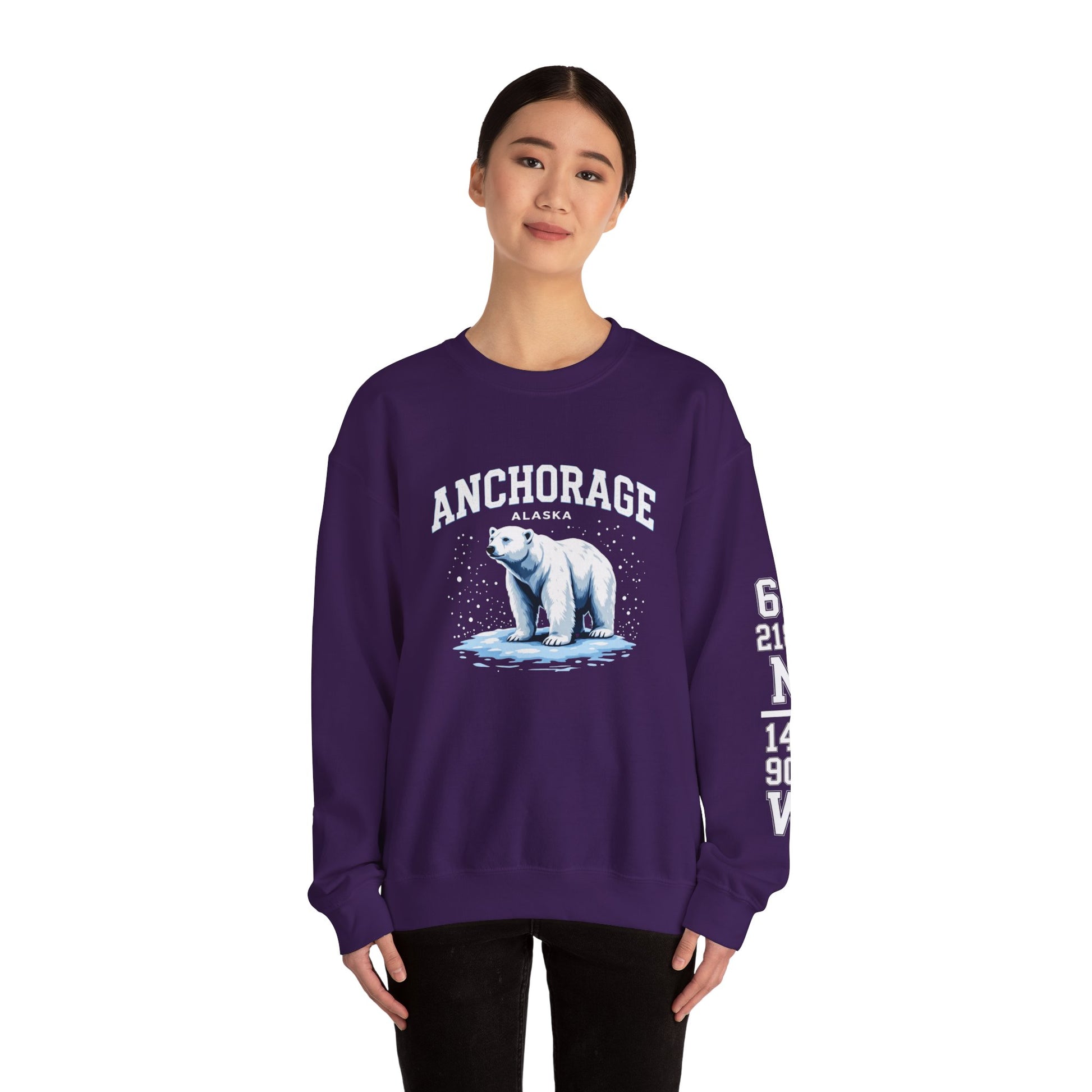 Person wearing a purple sweatshirt with a polar bear graphic and 'Anchorage Alaska' text on a white background