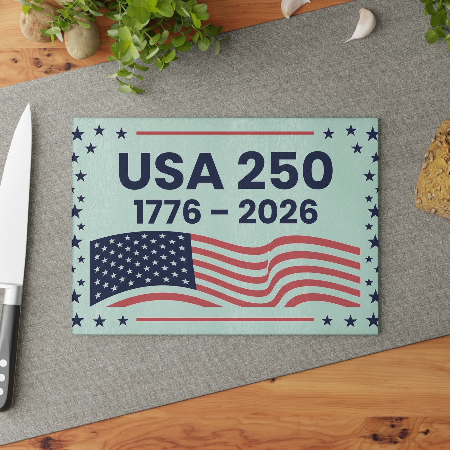 USA 250 anniversary cutting board with American flag design on a kitchen surface.