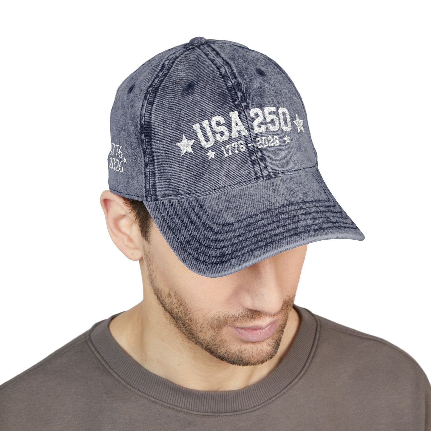 Man wearing a blue denim cap with 'USA 250' text on a white background