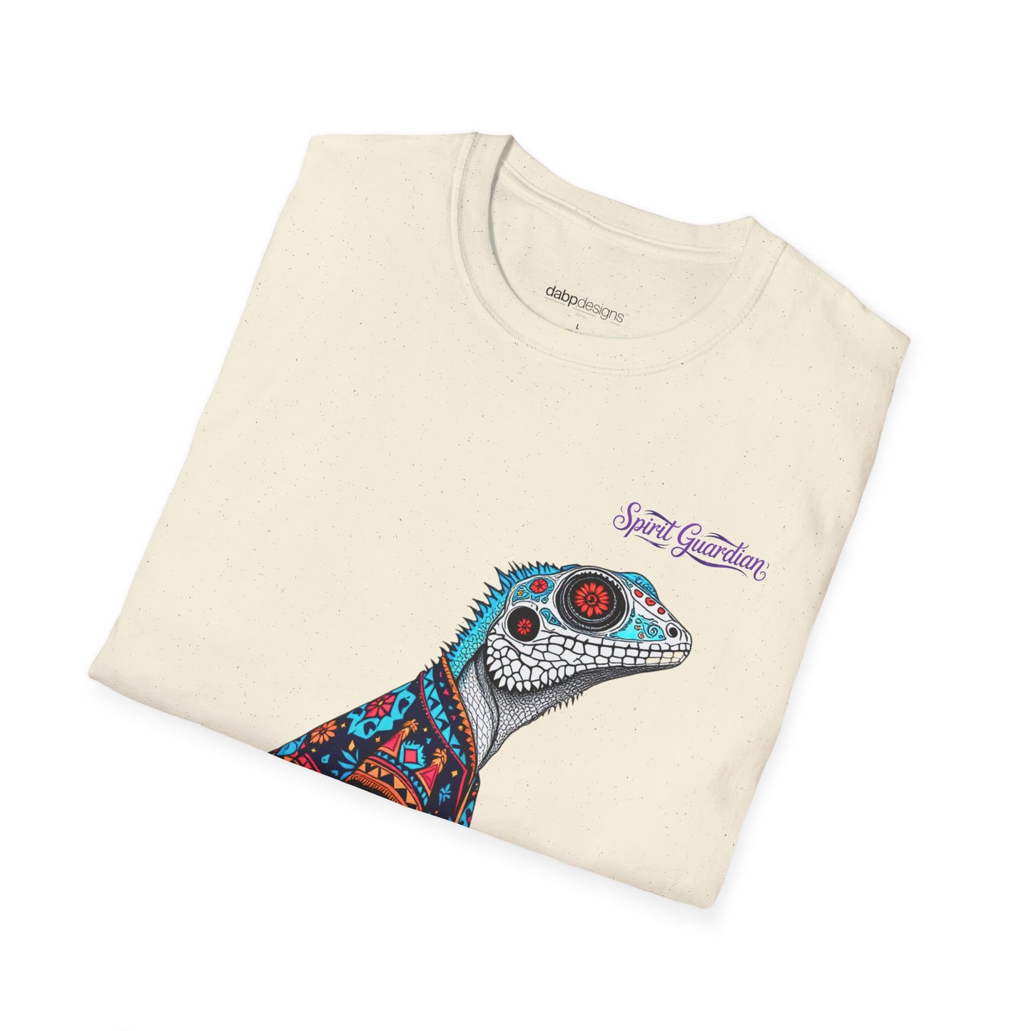 Folded t-shirt with a colorful lizard design and 'Spirit Guardian' text on a white background