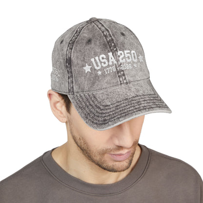 Man wearing a gray distressed cap with 'USA 250' text on a white background