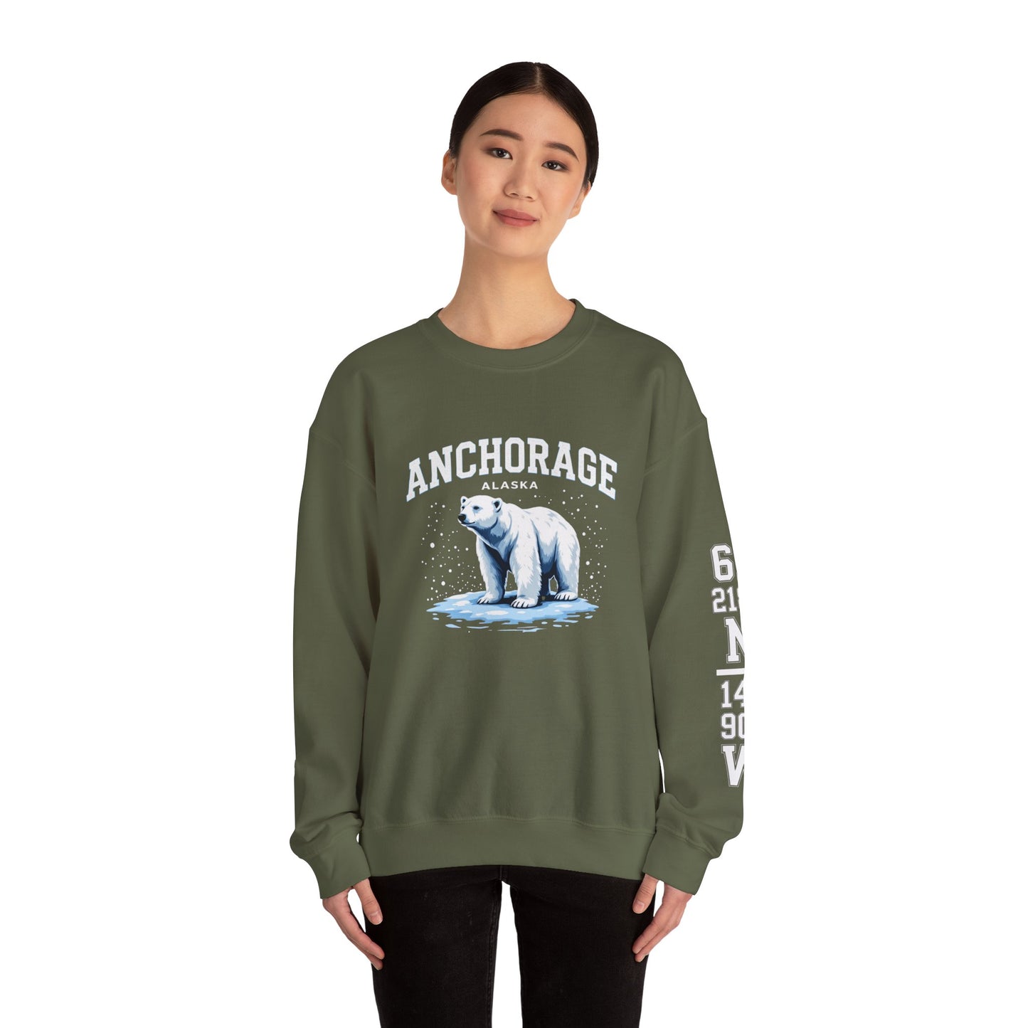 Person wearing a green sweatshirt with a polar bear graphic and 'Anchorage, Alaska' text on a white background