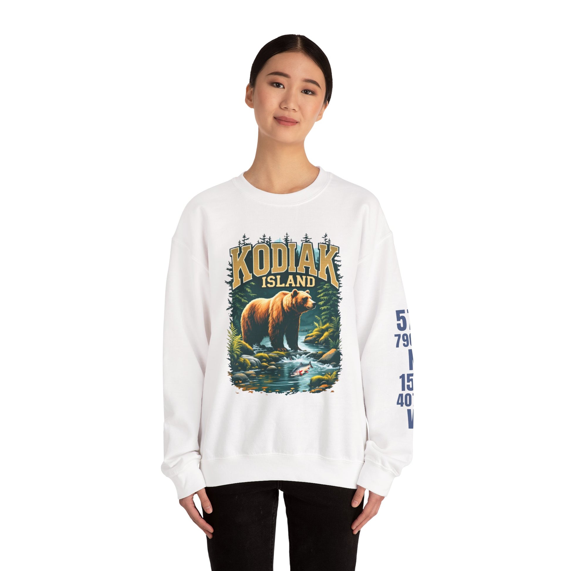 Person wearing a white sweatshirt with a bear graphic and 'Kodiak Island' text on a white background