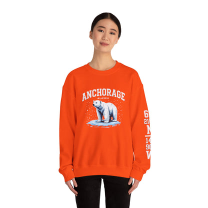 Person wearing an orange sweatshirt with a polar bear graphic and 'Anchorage' text on a white background
