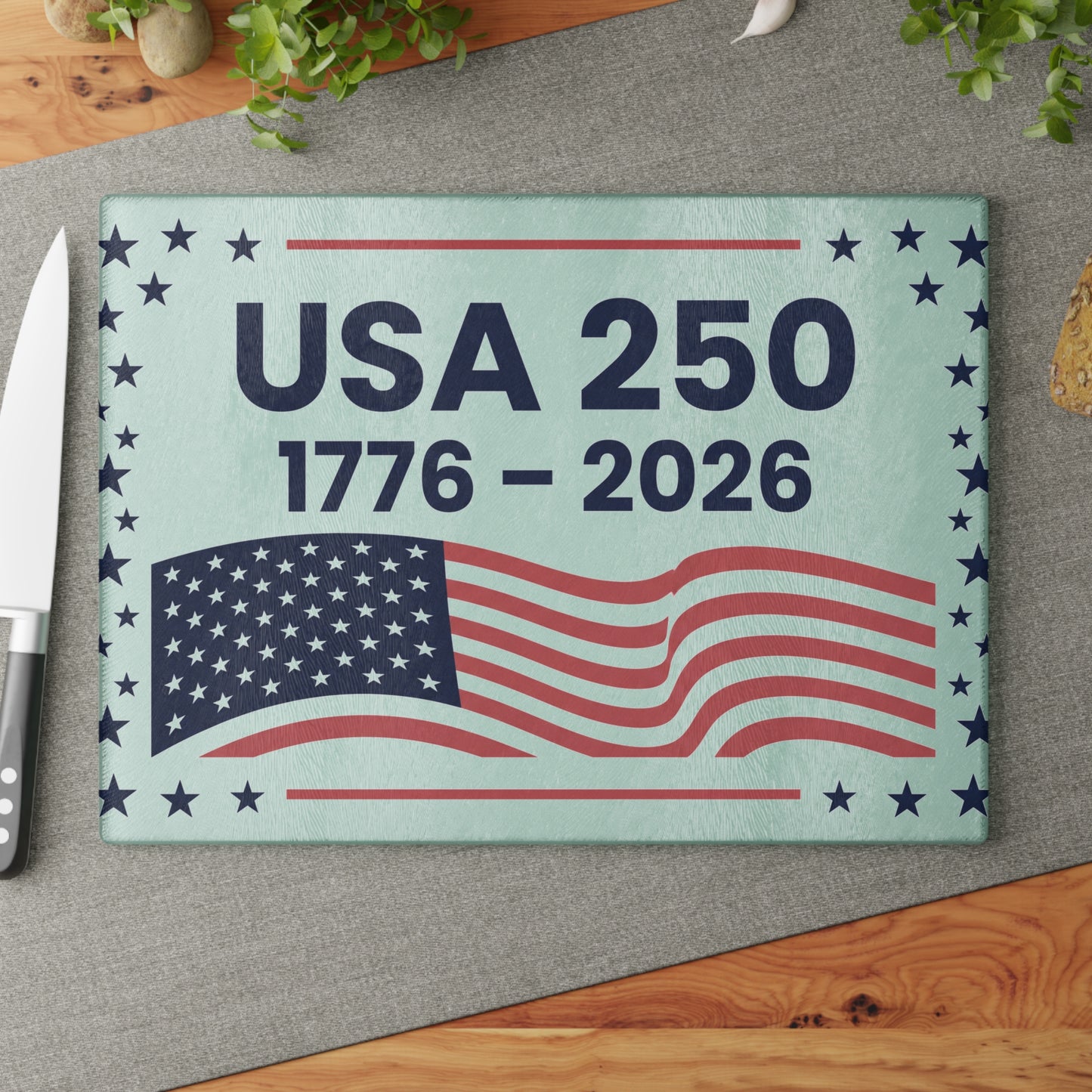 USA 250 anniversary cutting board with American flag design on a gray surface.