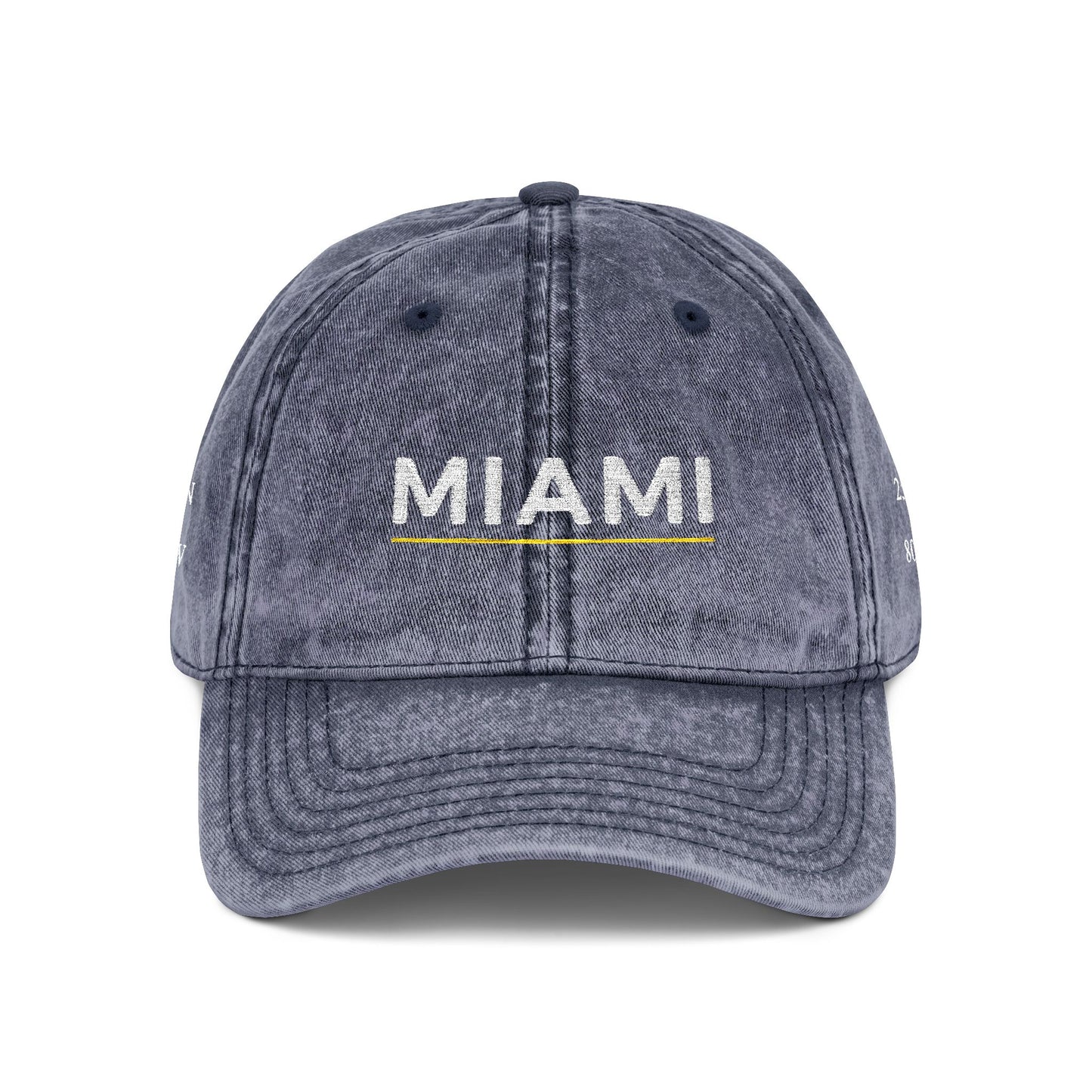 Blue denim cap with 'abide' embroidered on a white background