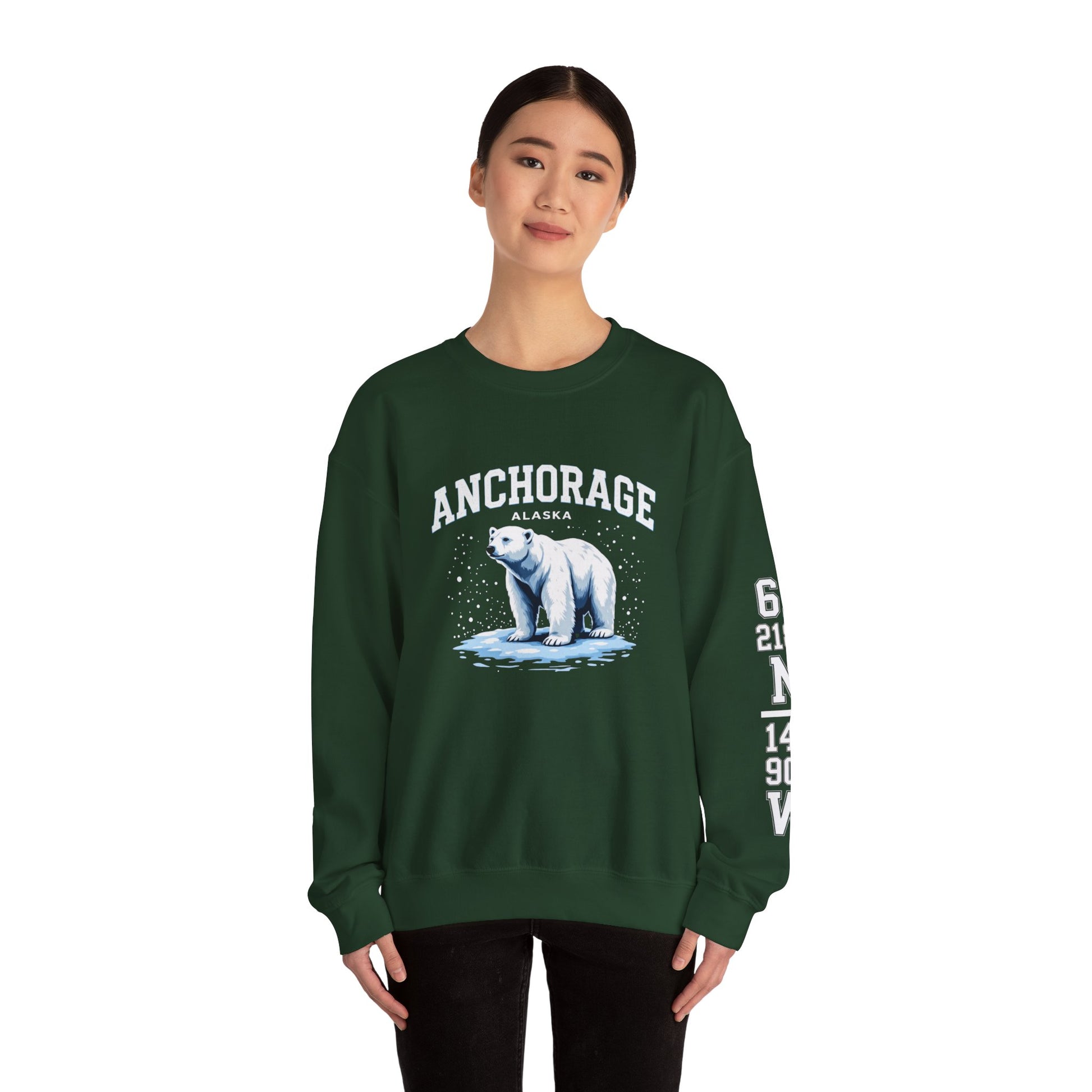 Person wearing a green sweatshirt with a polar bear graphic and 'Anchorage' text on a white background