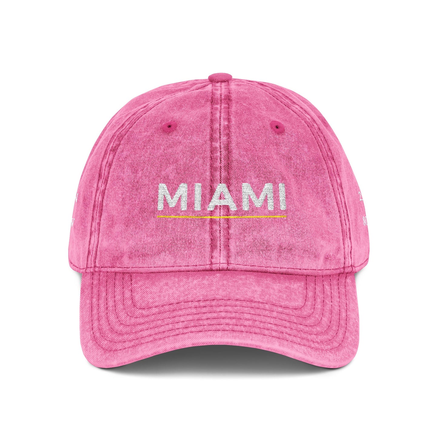 Pink cap with 'abide' embroidered on a white background
