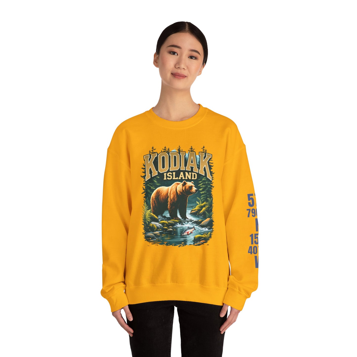 Person wearing a yellow sweatshirt with a bear graphic and 'Kodiak Island' text on a white background
