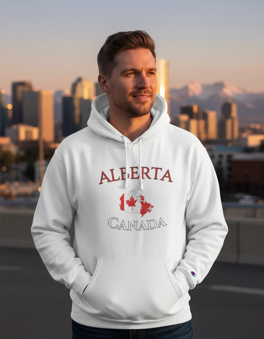 Man wearing a white hoodie with 'Alberta Canada' text and maple leaf design, standing in front of a city skyline.