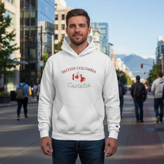 Man wearing a white hoodie with 'British Columbia Canada' text and maple leaf design on a city street.