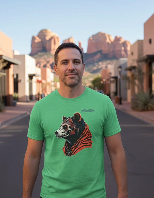 Man wearing a green t-shirt with a bear graphic in a desert town setting
