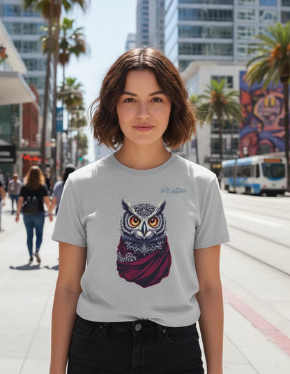 Person wearing a t-shirt with an owl design on a city street