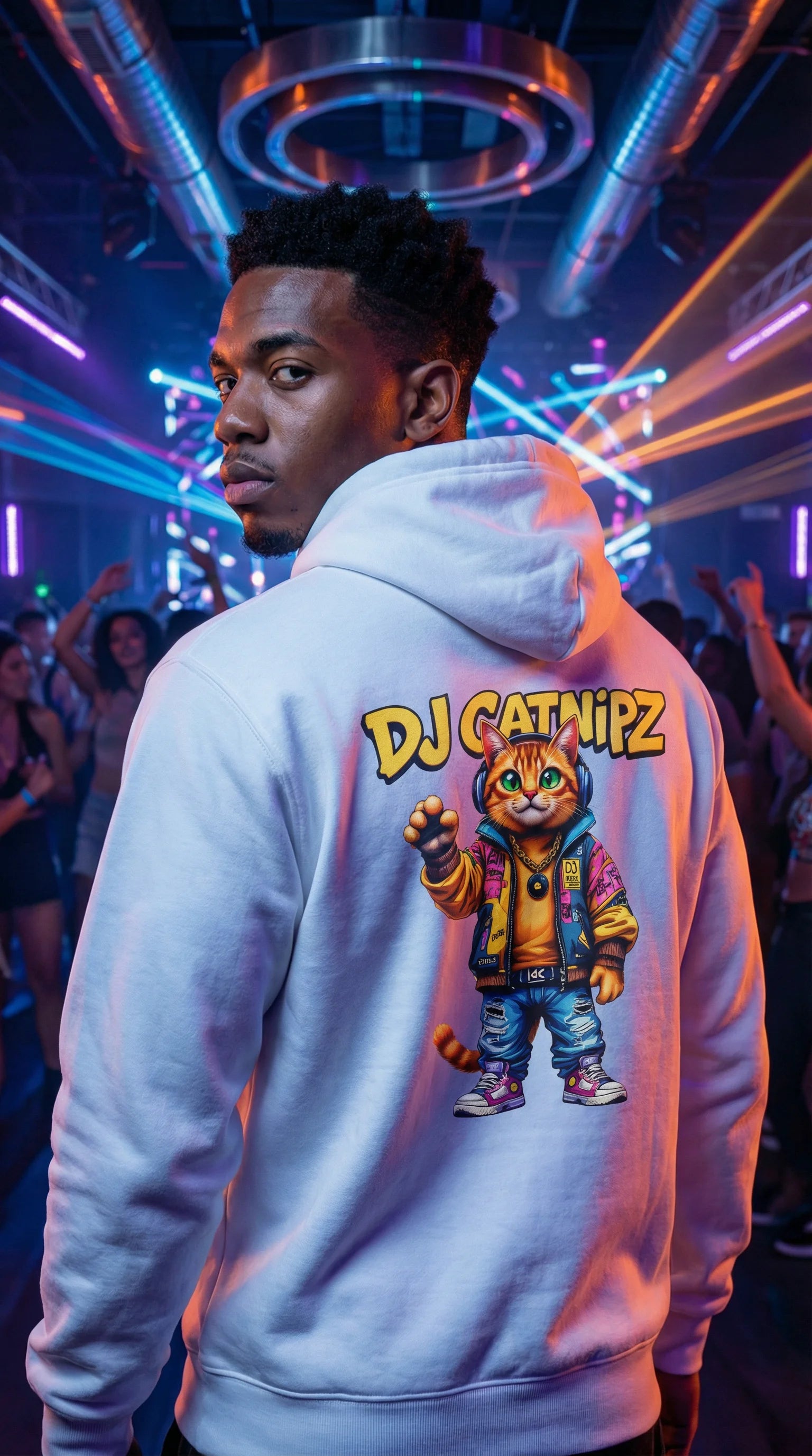 Person wearing a hoodie with 'DJ Catnipz' graphic in a neon-lit setting