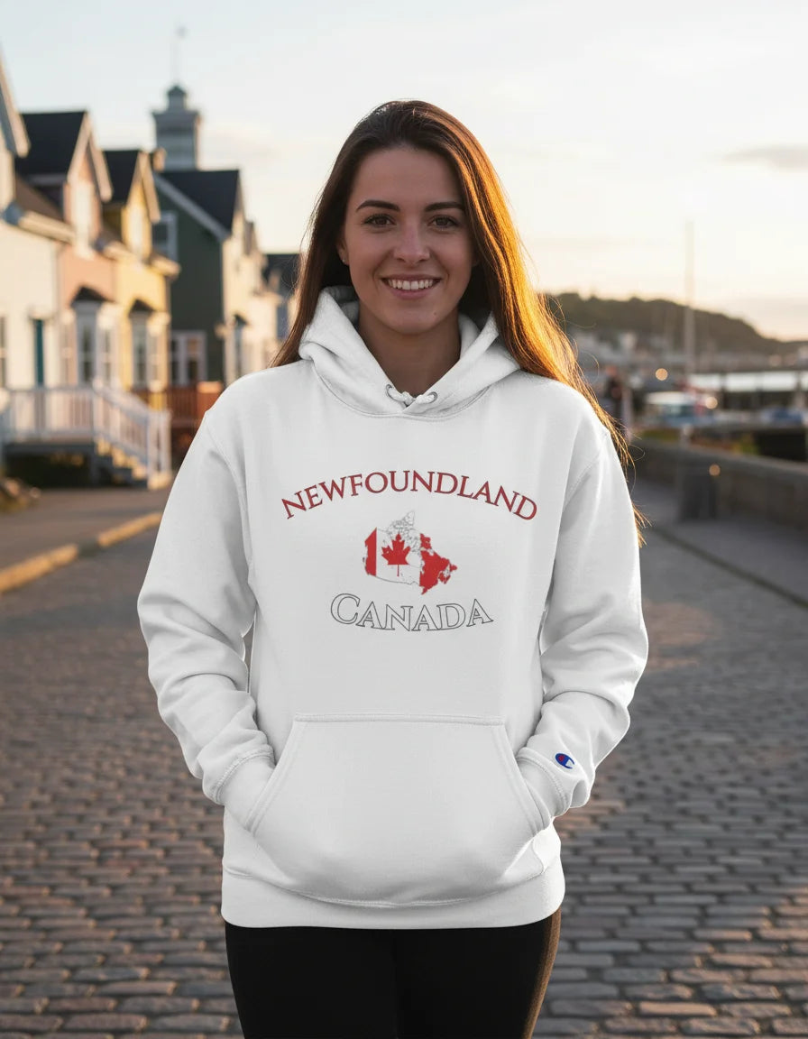 Woman wearing a white hoodie with 'Newfoundland Canada' design, standing on a street.