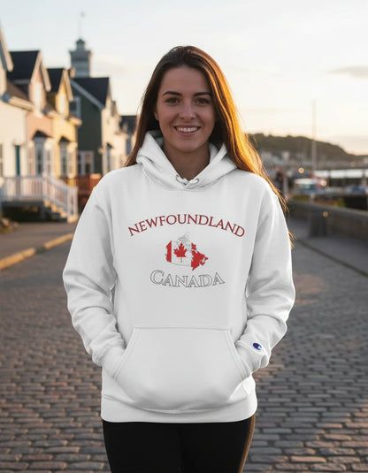 Woman wearing a white hoodie with 'Newfoundland Canada' design, standing on a street.