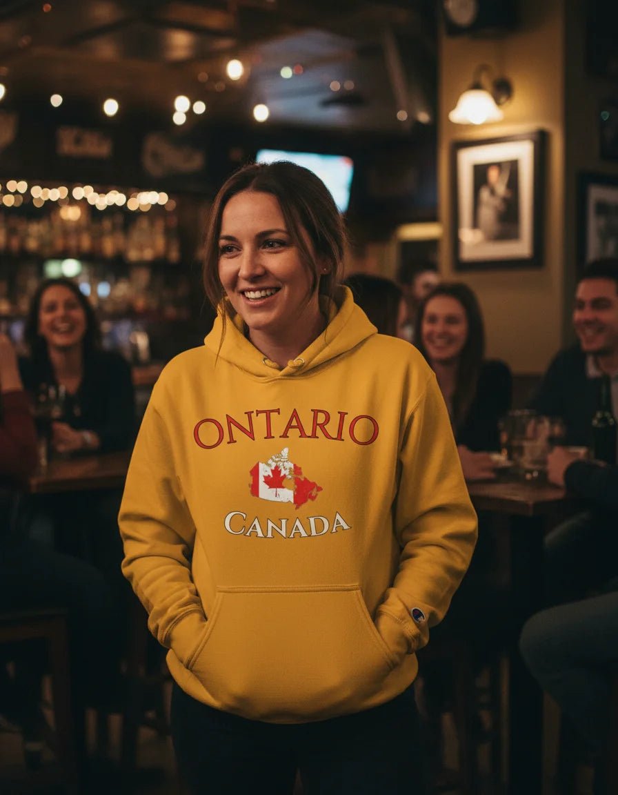 Person wearing a yellow hoodie with 'Ontario Canada' text in a pub setting