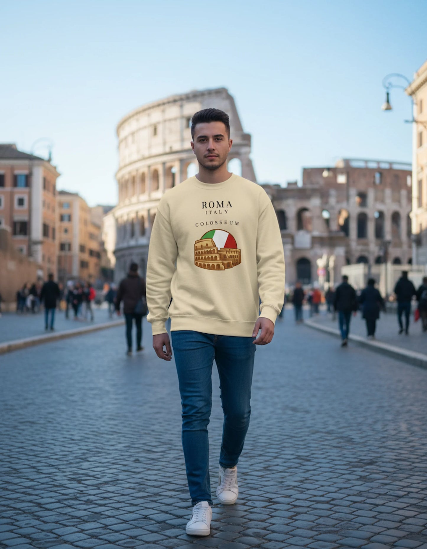Man wearing a beige sweatshirt with Colosseum design in Rome