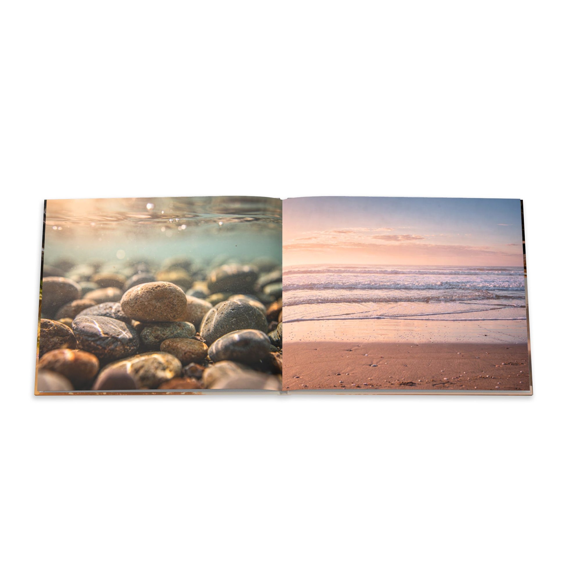 Open book showing two scenic images: pebbles on a beach and waves at sunset.