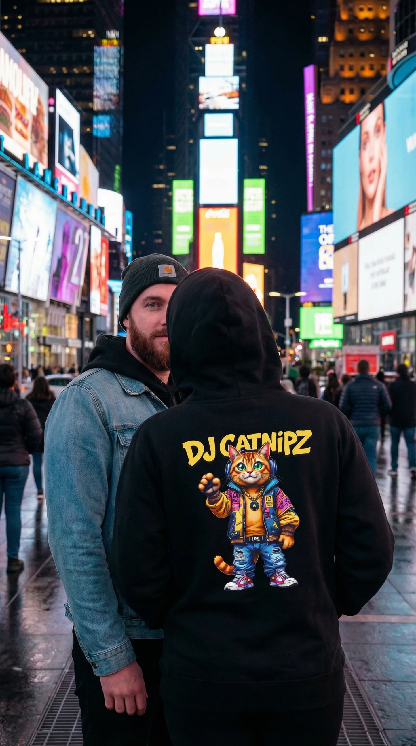 Two people in a city street at night with colorful billboards in the background